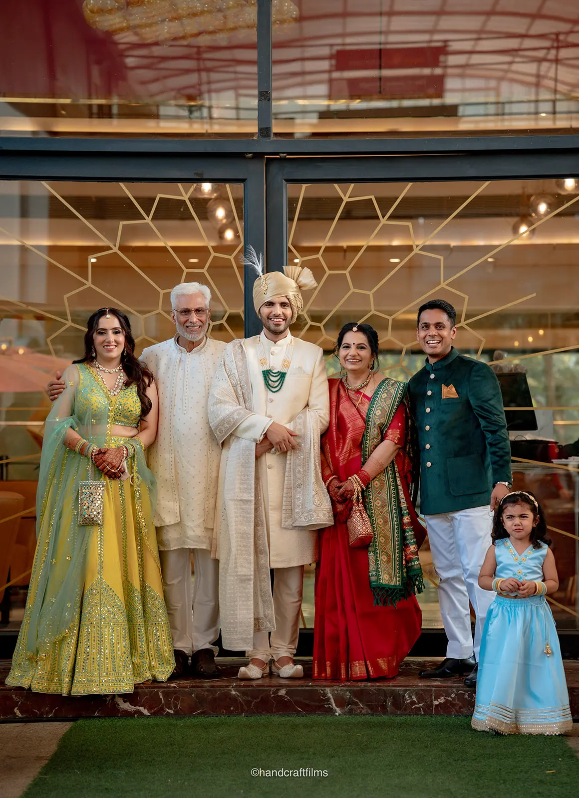 Groom with his parents, sister, brother-in-law, and niece before the Baraat